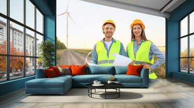 Engineers on windmill farm for electric power production Wall mural