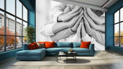 Family praying together at home, closeup Wall mural