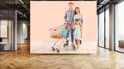 Family with shopping cart near color wall Wall mural