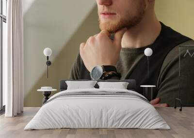 Fashionable young man with watch indoors, closeup Wall mural