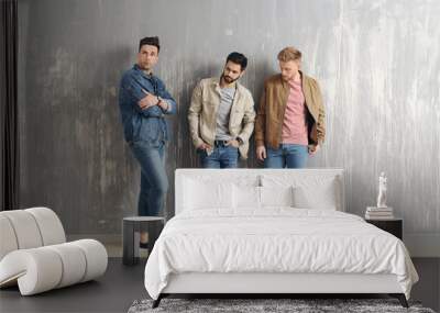 fashionable young men near grey wall Wall mural