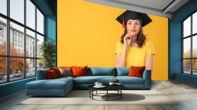 Female graduating student on color background Wall mural