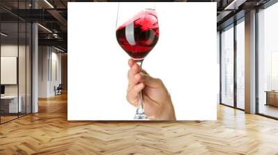 Female hand holding glass of red wine isolated on white background Wall mural