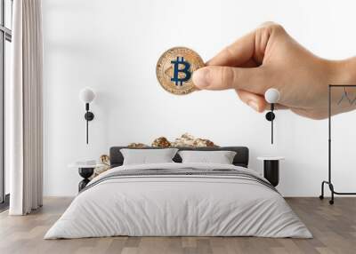 Female hand with bitcoin and gold nuggets on white background Wall mural