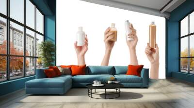 Female hands with different cosmetic products in bottles on white background Wall mural