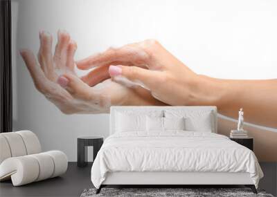 Female hands with soap on white background Wall mural