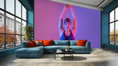 Female swimmer on color background Wall mural