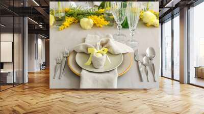 Festive table setting with painted eggs and flowers served for Easter celebration Wall mural