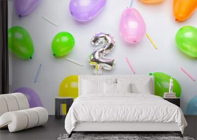 Figure 2, different balloons and candles on light background Wall mural