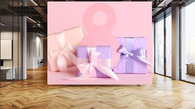 Figure 8 made of paper and gift boxes on pink background. International Women's Day Wall mural