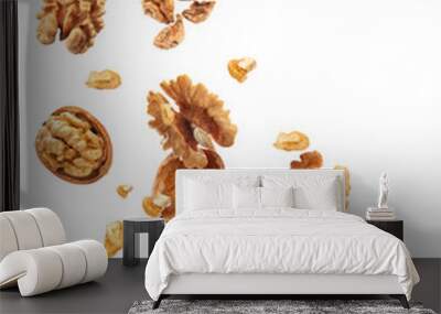 Flying walnuts isolated on white Wall mural