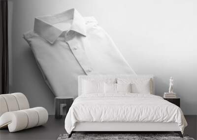 Folded male shirt on light background Wall mural