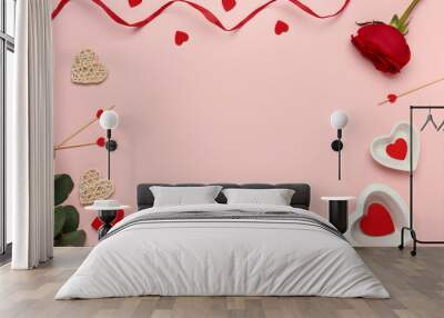 Frame made of beautiful table setting with red rose and ribbon on pink background. Valentine's Day celebration Wall mural