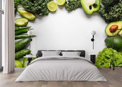 Frame made of fresh green vegetables on white background Wall mural