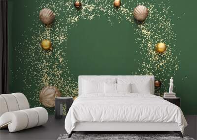 Frame made of golden confetti and Christmas balls on green background Wall mural