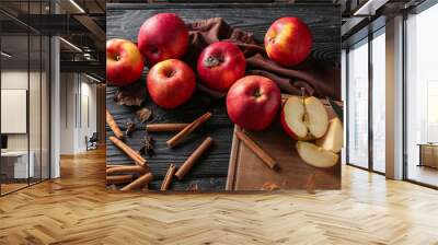 Fresh apples and cinnamon sticks on wooden background Wall mural