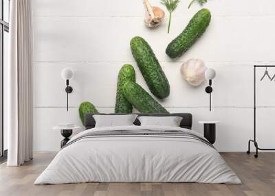 Fresh cucumbers, garlic and dill on white wooden background Wall mural