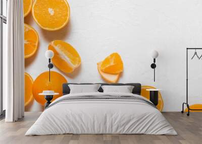 Fresh juicy oranges on light background Wall mural