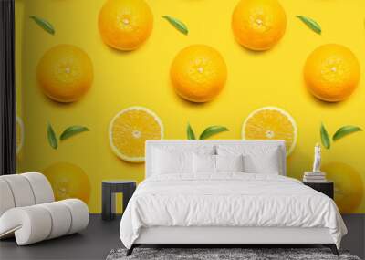 Fresh oranges with green leaves on color background Wall mural