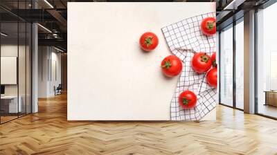 Fresh ripe tomatoes and napkin on light background Wall mural