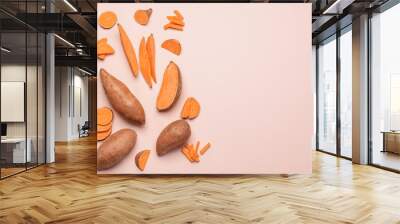 Fresh sweet potatoes on light background Wall mural