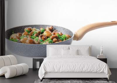 Frying pan with tasty cooked mushrooms on white background Wall mural