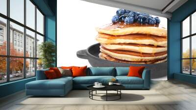 Frying pan with tasty pancakes and blueberries on white background, closeup Wall mural