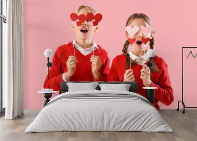 Funny little children with paper hearts on pink background. Valentine's day celebration Wall mural