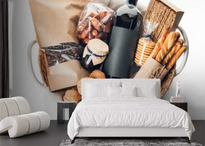 Gift basket with products on white background Wall mural