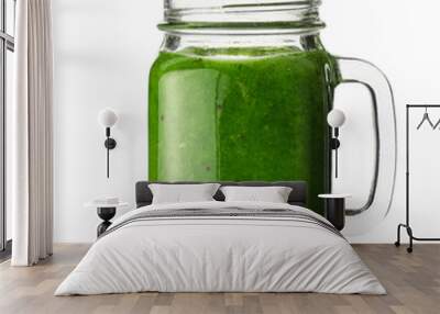 Glass mason jar of tasty green juice on white background Wall mural