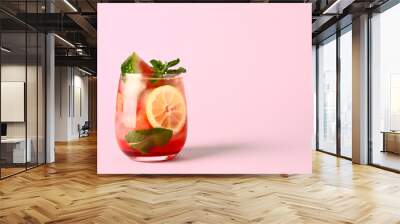 Glass of fresh watermelon lemonade with mint on pink background Wall mural