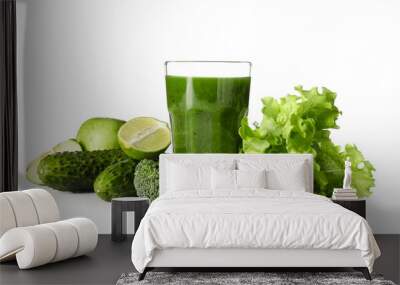 Glass of healthy green juice and fresh ingredients on white background Wall mural