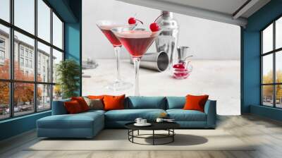 Glasses of delicious Manhattan cocktail on light background Wall mural