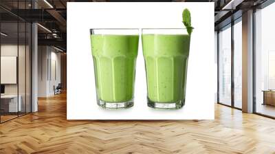 Glasses of healthy green juice on white background Wall mural