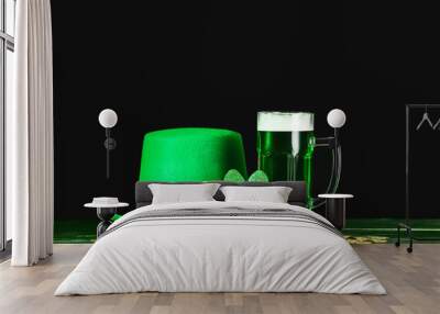 Green beer and Leprechaun's hat on table. St. Patrick's Day celebration Wall mural