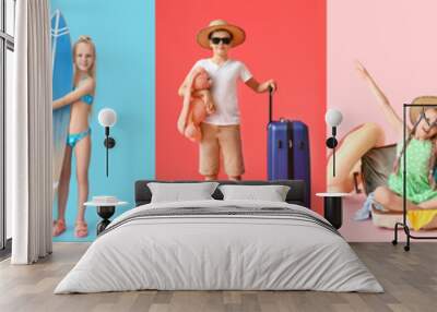 Group of little children with inflatable ring, surfboard, snorkeling gear and suitcases on color background Wall mural