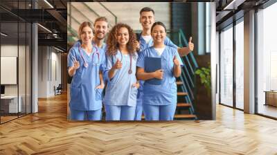 Group of medical students in corridor of modern clinic Wall mural