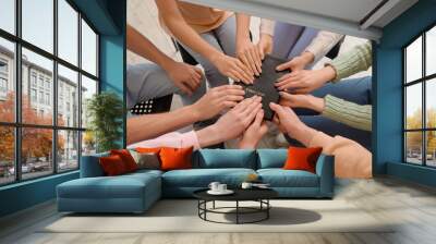 Group of people praying with Holy Bible in room, closeup Wall mural