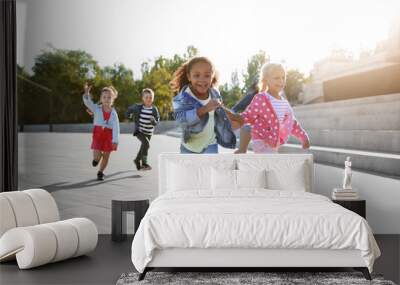 Group of running children outdoors Wall mural