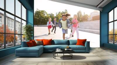 Group of running children outdoors Wall mural