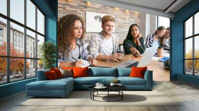 Group of students preparing for exam in university Wall mural