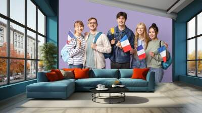 Group of students with French flags on lilac background Wall mural