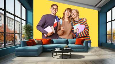 Group of students with French flags on yellow background Wall mural