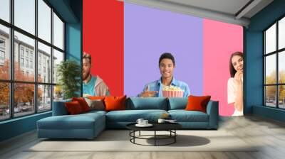 Group of young people with crunchy popcorn on colorful background with space for text Wall mural