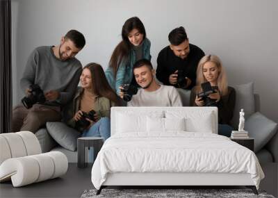 Group of young photographers during master class in studio Wall mural