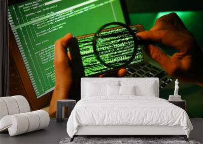 Hacker with mobile phone, magnifier and computer Wall mural