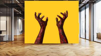 Hands of zombie on yellow background. Halloween celebration Wall mural