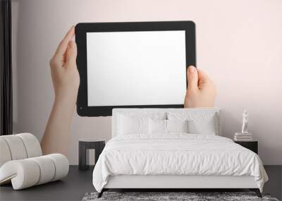 Hands with modern tablet computer on light background Wall mural