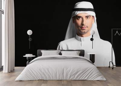 Handsome Arab man on dark background Wall mural