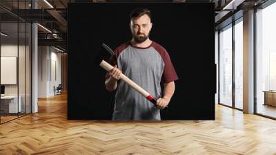 Handsome lumberjack on dark background Wall mural